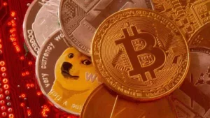 Representations of cryptocurrencies Bitcoin, Ethereum, DogeCoin, Ripple, Litecoin are placed on PC motherboard in this illustration. (REUTERS)