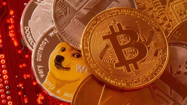 Representations Of Cryptocurrencies Bitcoin, Ethereum, Dogecoin, Ripple, Litecoin Are Placed On Pc Motherboard In This Illustration. (Reuters)