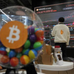 An Employee Watches An Electronic Signboard Displaying The Prices Of Bitcoin And Other Cryptocurrencies At The Lounge Of Bithumb Cryptocurrency Exchange In Seoul, South Korea, Thursday, Nov. 21, 2024. (Ap Photo/Ahn Young-Joon)